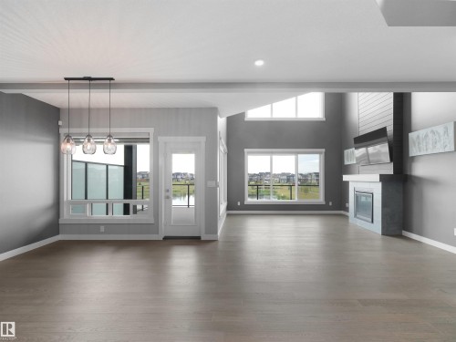 20715 27 Avenue Nw, Edmonton, AB - Indoor Photo Showing Living Room With Fireplace