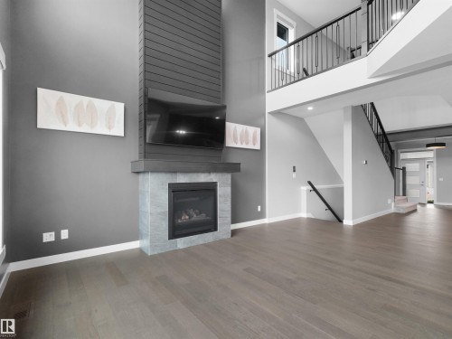 20715 27 Avenue Nw, Edmonton, AB - Indoor Photo Showing Living Room With Fireplace