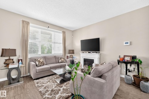 6136 Rosenthal Way Nw, Edmonton, AB - Indoor Photo Showing Living Room With Fireplace