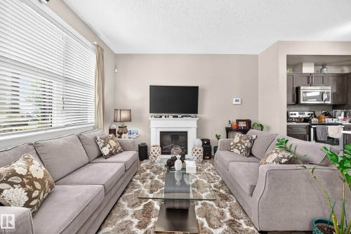 6136 Rosenthal Way Nw, Edmonton, AB - Indoor Photo Showing Living Room With Fireplace