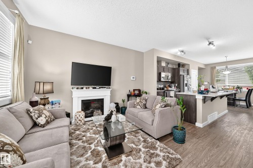 6136 Rosenthal Way Nw, Edmonton, AB - Indoor Photo Showing Living Room With Fireplace
