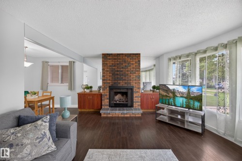 39 Apache Crescent, Leduc, AB - Indoor Photo Showing Living Room With Fireplace