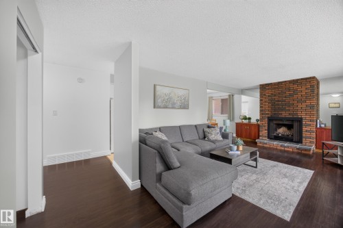 39 Apache Crescent, Leduc, AB - Indoor Photo Showing Living Room With Fireplace