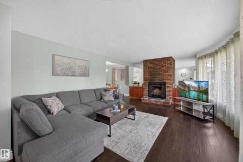 39 Apache Crescent, Leduc, AB - Indoor Photo Showing Living Room With Fireplace