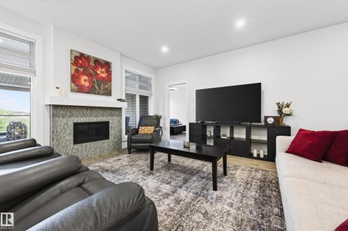 91 Harvest Crescent, Ardrossan, AB - Indoor Photo Showing Living Room With Fireplace