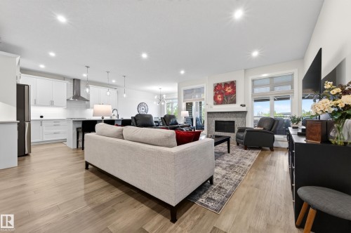 91 Harvest Crescent, Ardrossan, AB - Indoor Photo Showing Other Room With Fireplace
