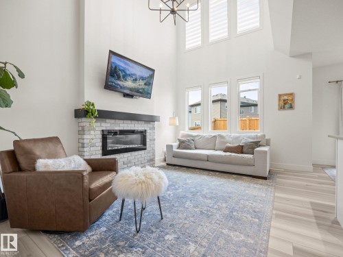 3808 42 Avenue, Beaumont, AB - Indoor Photo Showing Living Room With Fireplace