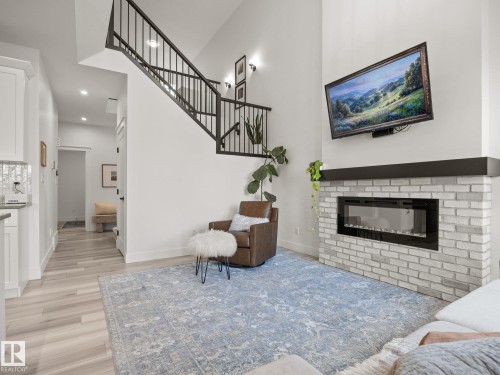 3808 42 Avenue, Beaumont, AB - Indoor Photo Showing Living Room With Fireplace