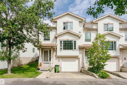 Multi-story residence featuring light-colored siding and a gabled roofline - #42 9630 176 St Nw, Edmonton, AB - Outdoor With Facade