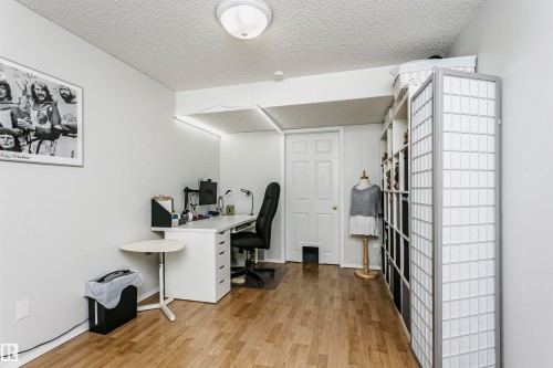 Wood-finish flooring throughout - #42 9630 176 St Nw, Edmonton, AB - Indoor Photo Showing Office