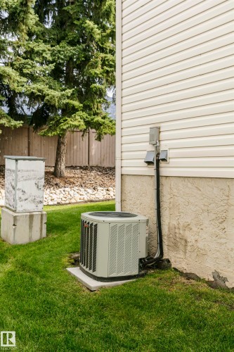 Exterior featuring horizontal siding, a visible air conditioning unit, and a concrete foundation - #42 9630 176 St Nw, Edmonton, AB - Outdoor