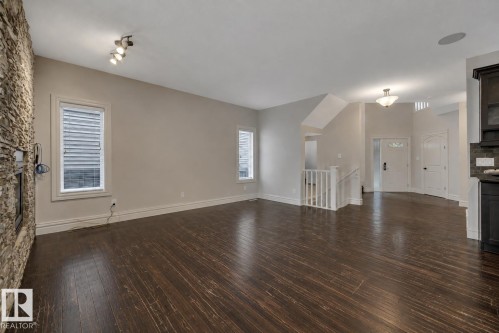 1047 Armitage Crescent Sw, Edmonton, AB - Indoor Photo Showing Other Room With Fireplace