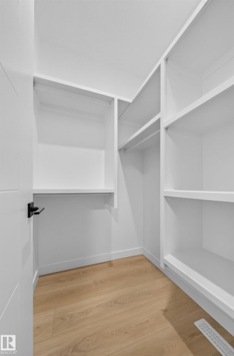 Custom shelving and hanging rods - 8915 Mayday Way Sw, Edmonton, AB - Indoor With Storage