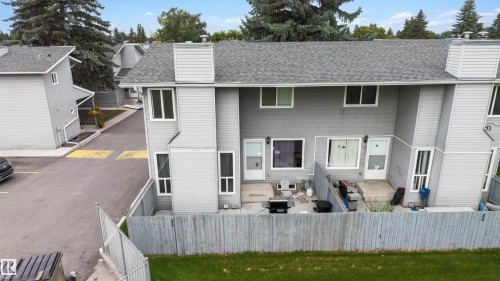 Rear patios with private fenced yards - #44 1415 62 St Nw, Edmonton, AB - Outdoor With Exterior