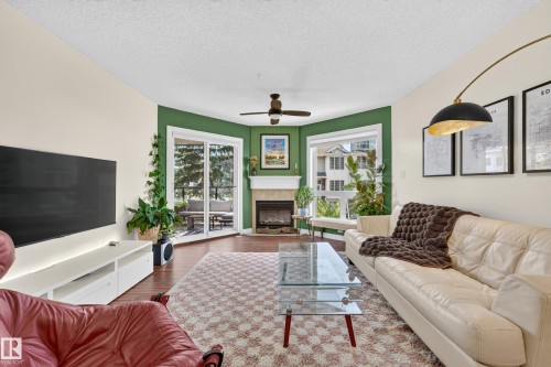 #206 7839 96 St Nw, Edmonton, AB - Indoor Photo Showing Living Room With Fireplace