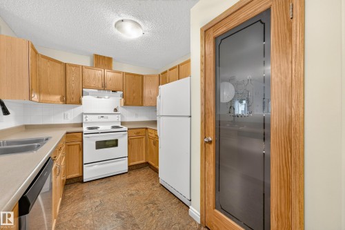 #206 7839 96 St Nw, Edmonton, AB - Indoor Photo Showing Kitchen With Double Sink