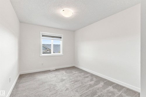 Neutral paint finishes - 22019 82 Avenue Nw, Edmonton, AB - Indoor Photo Showing Other Room