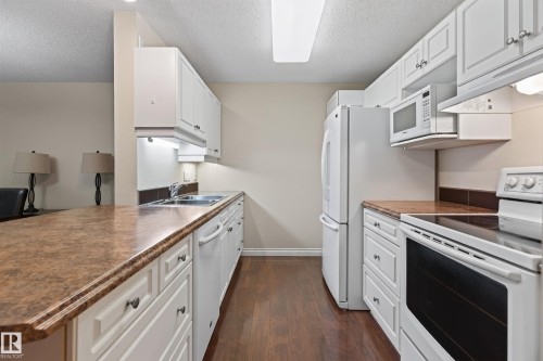 #101 911 Rabbit Hill Rd Nw, Edmonton, AB - Indoor Photo Showing Kitchen With Double Sink