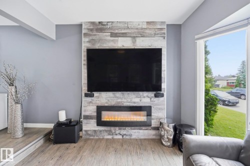 10528 45 Street Nw, Edmonton, AB - Indoor Photo Showing Living Room With Fireplace