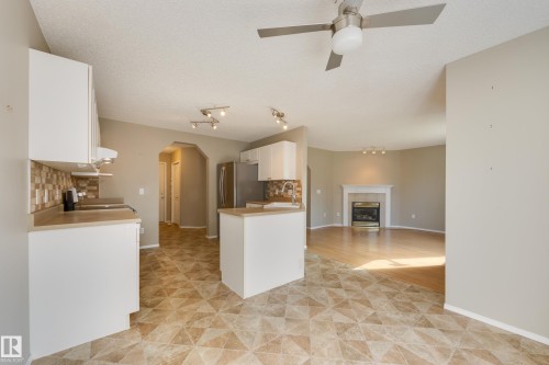11335 167B Ave Nw, Edmonton, AB - Indoor Photo Showing Kitchen With Fireplace