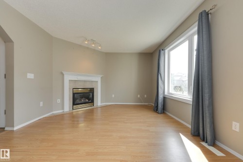 11335 167B Ave Nw, Edmonton, AB - Indoor Photo Showing Living Room With Fireplace