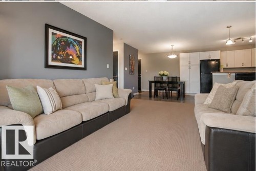 #340 2436 Guardian Rd Nw, Edmonton, AB - Indoor Photo Showing Living Room