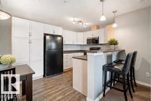 #340 2436 Guardian Rd Nw, Edmonton, AB - Indoor Photo Showing Kitchen