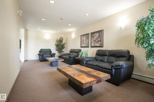 #340 2436 Guardian Rd Nw, Edmonton, AB - Indoor Photo Showing Living Room