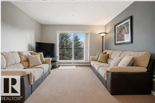 #340 2436 Guardian Rd Nw, Edmonton, AB - Indoor Photo Showing Living Room