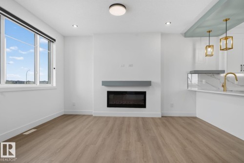 450 Robinson Blvd, Leduc, AB - Indoor Photo Showing Living Room With Fireplace