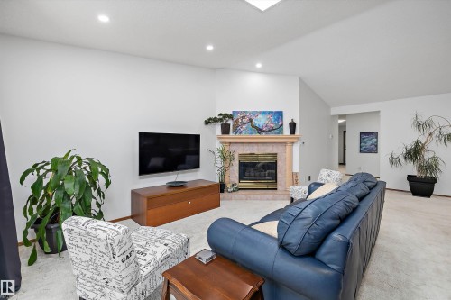 4717 25 Avenue Nw, Edmonton, AB - Indoor Photo Showing Living Room With Fireplace