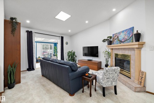 4717 25 Avenue Nw, Edmonton, AB - Indoor Photo Showing Living Room With Fireplace