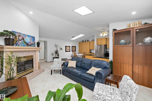 4717 25 Avenue Nw, Edmonton, AB - Indoor Photo Showing Living Room With Fireplace