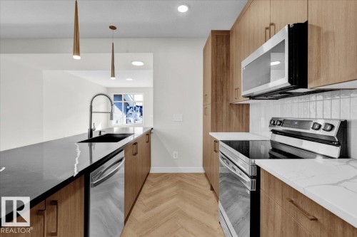 #71 16231 19 Av Sw, Edmonton, AB - Indoor Photo Showing Kitchen With Upgraded Kitchen