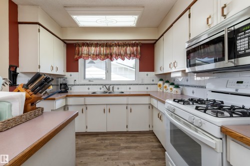 7 Camelot Crescent, Leduc, AB - Indoor Photo Showing Kitchen With Double Sink