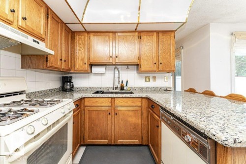 3303 42A Avenue Nw, Edmonton, AB - Indoor Photo Showing Kitchen