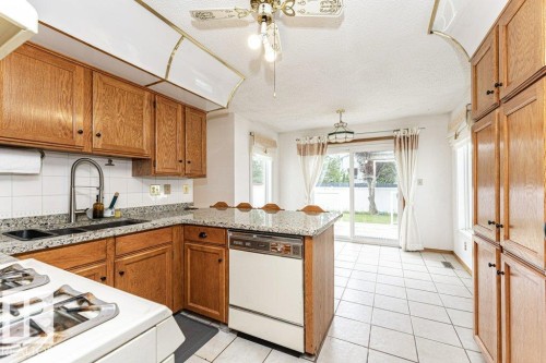 3303 42A Avenue Nw, Edmonton, AB - Indoor Photo Showing Kitchen With Double Sink