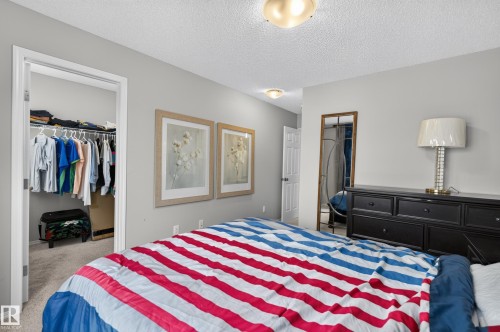 Recessed closet with carpet flooring - 17 Spruce Ridge Cove, Spruce Grove, AB - Indoor Photo Showing Bedroom