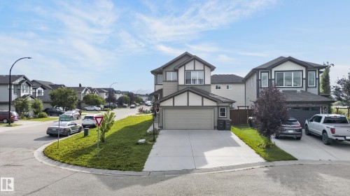Two-story residence featuring a two-car garage, concrete driveway, and a partially landscaped front yard - 17 Spruce Ridge Cove, Spruce Grove, AB - Outdoor With Facade