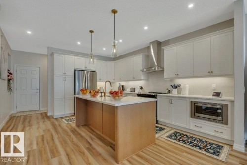 169 Stonehouse Way, Leduc, AB - Indoor Photo Showing Kitchen With Stainless Steel Kitchen With Upgraded Kitchen
