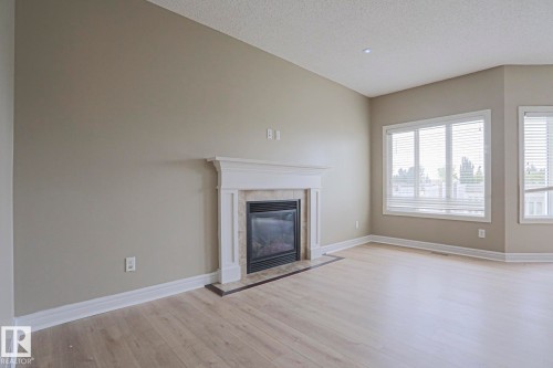 1456 33B Street Nw, Edmonton, AB - Indoor Photo Showing Living Room With Fireplace