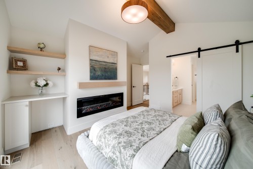 95 Jubilation Drive, St. Albert, AB - Indoor Photo Showing Bedroom With Fireplace