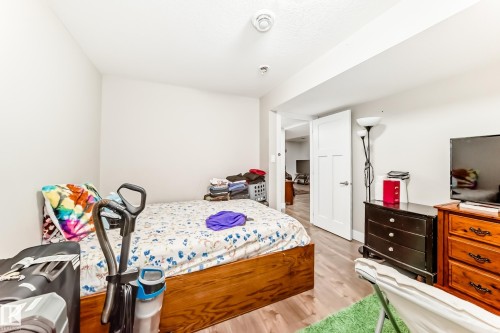 Room featuring wood-finish flooring and light-toned walls - 2812 12 Street Nw, Edmonton, AB - Indoor