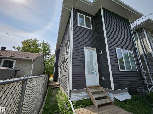 Dark-tone horizontal siding with white trim - 15212 98 Avenue Nw, Edmonton, AB - Outdoor With Exterior