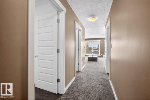 Hallway with textured carpeting and recessed lighting - 3936 Claxton Loop Sw, Edmonton, AB - Indoor Photo Showing Other Room
