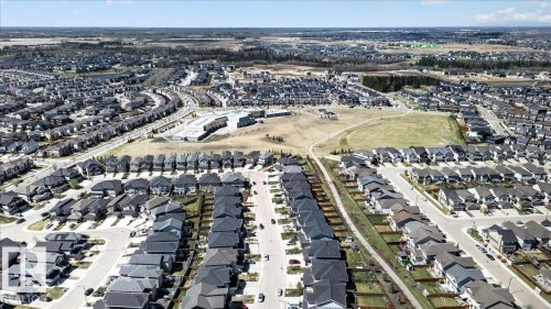 Residential development with numerous detached homes, paved streets, and open green spaces - 3936 Claxton Loop Sw, Edmonton, AB - Outdoor With View