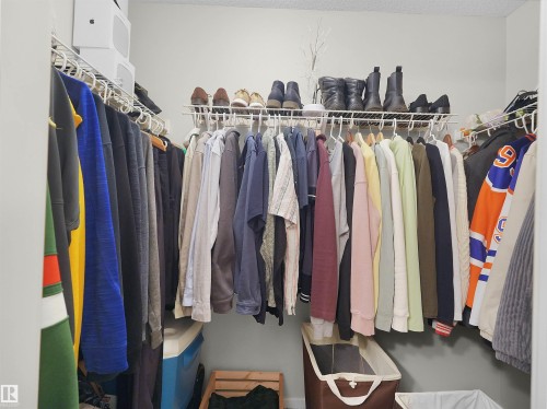 Walk-in closet featuring wire shelving and clothing rods - #89 603 Watt Bv Sw, Edmonton, AB - Indoor With Storage
