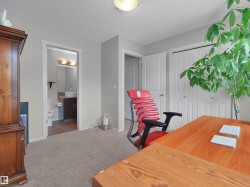 Neutral-toned walls complement the carpeted flooring - 