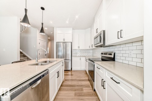 17764 73 Street Nw, Edmonton, AB - Indoor Photo Showing Kitchen With Stainless Steel Kitchen With Double Sink With Upgraded Kitchen