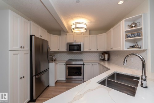 #304 14 Mission Av, St. Albert, AB - Indoor Photo Showing Kitchen With Stainless Steel Kitchen With Double Sink